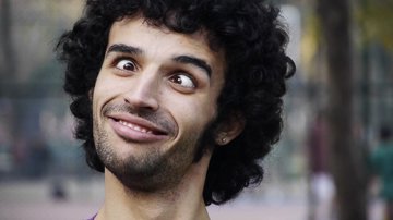 young-man-funny-face-squinting-skew-eyed-eye_thumb